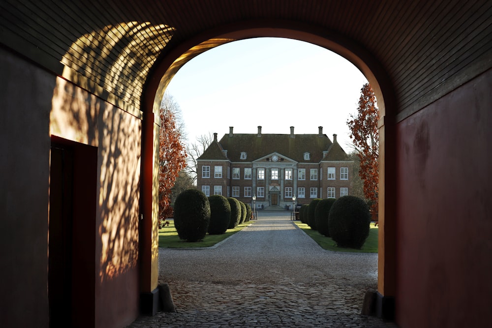 a view of a large building through an archway