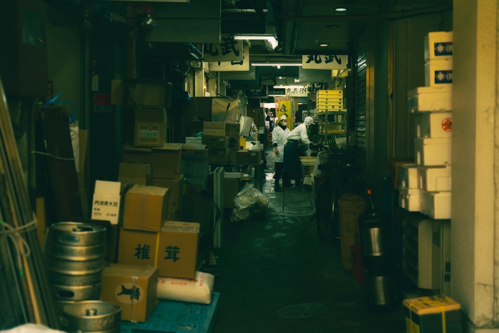 a narrow alley way with people walking through it