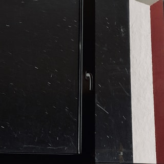 Close-up of a freshly painted door frame with crisp, clean edges.