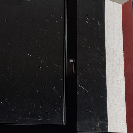 Close-up of a sleek white PVC window frame installed in a modern home.