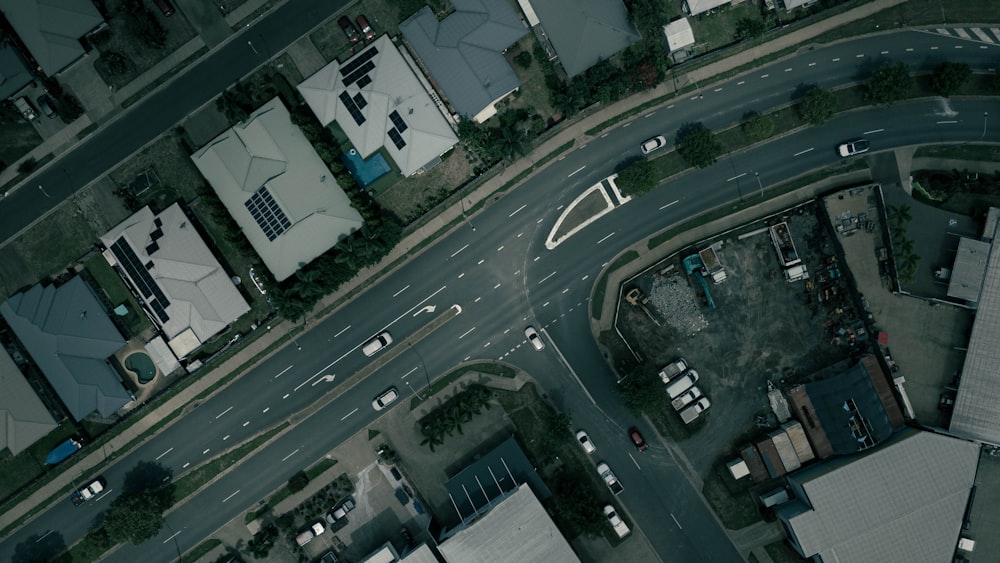 an aerial view of a street intersection with buildings