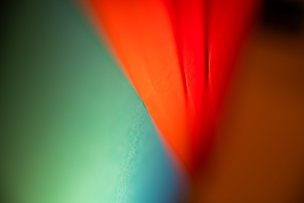 a close up of a red, orange, and blue object
