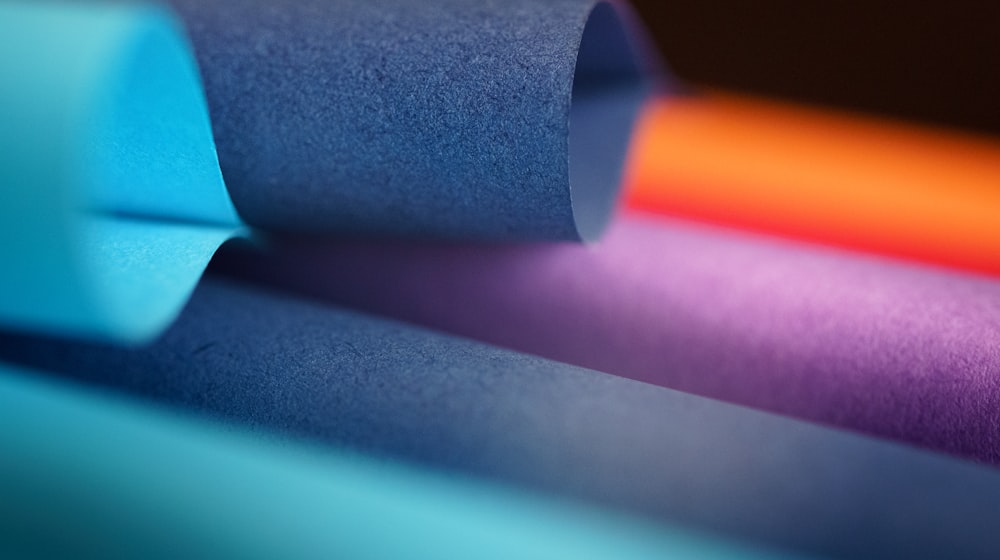 a close up of a roll of colored paper
