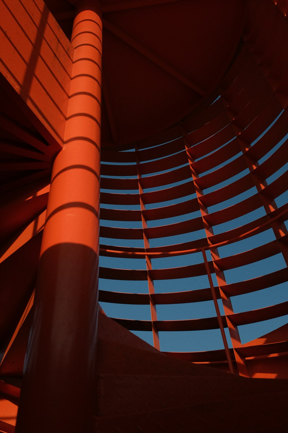 a close up of a metal structure with a blue sky in the background