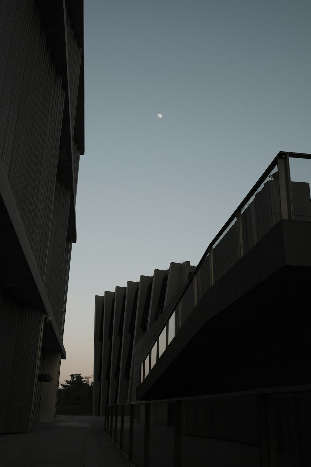 a building with a half moon in the sky