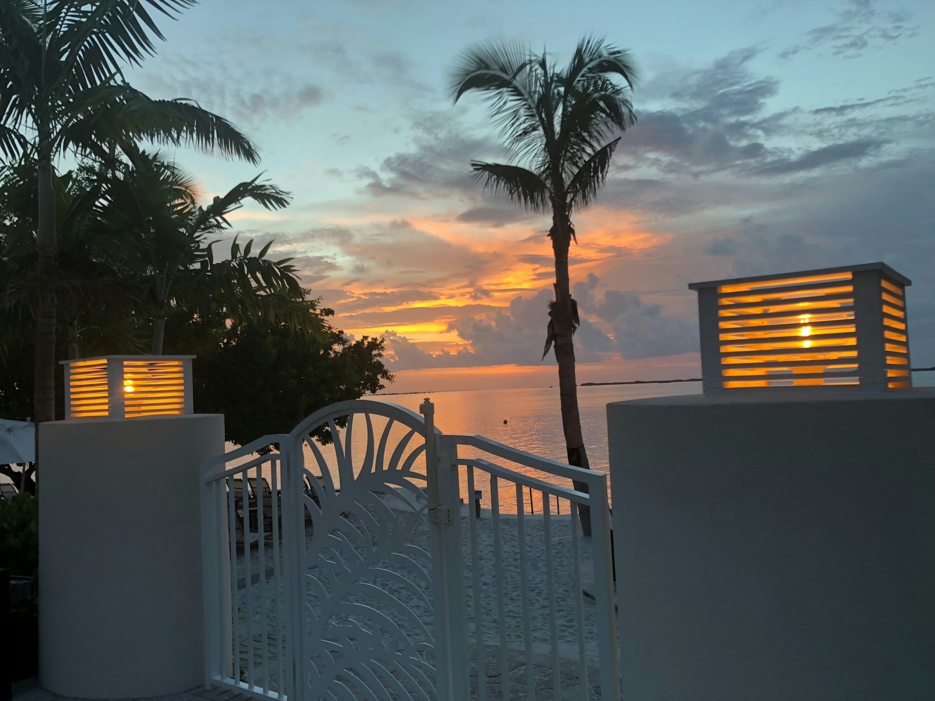 woman wearing yellow long-sleeved dress under white clouds and blue sky during daytime