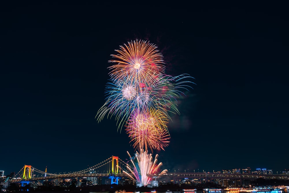 a fireworks display over a city at night