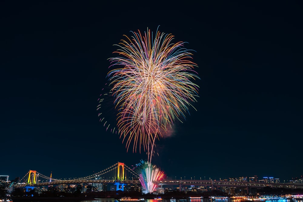 a fireworks display over a city at night