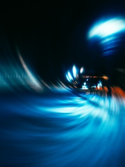 a blurry photo of a blue and orange swirl