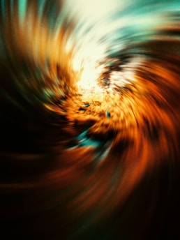 a blurry image of a swirl in orange and blue