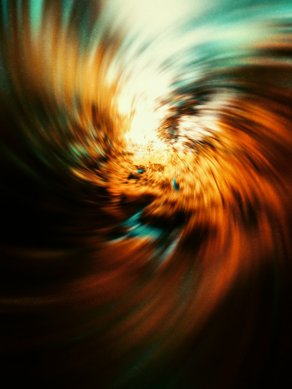 a blurry image of a swirl in orange and blue