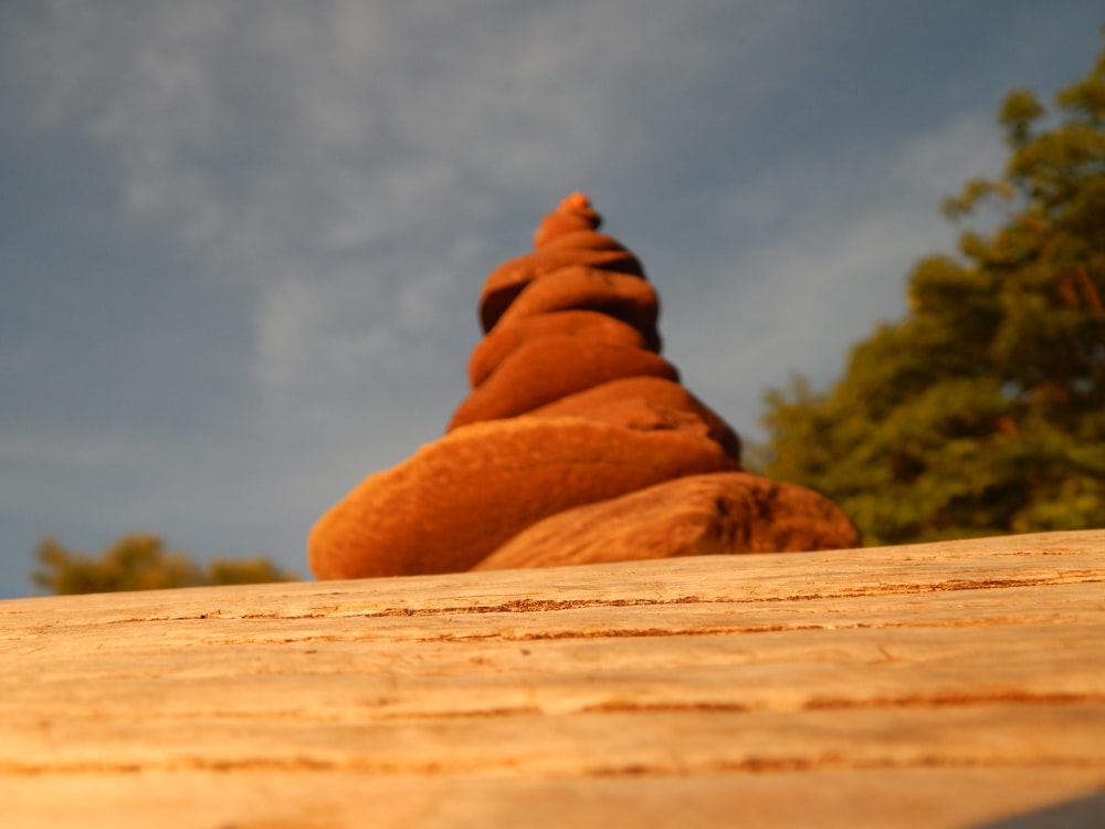 a rock formation sitting on top of a wooden table