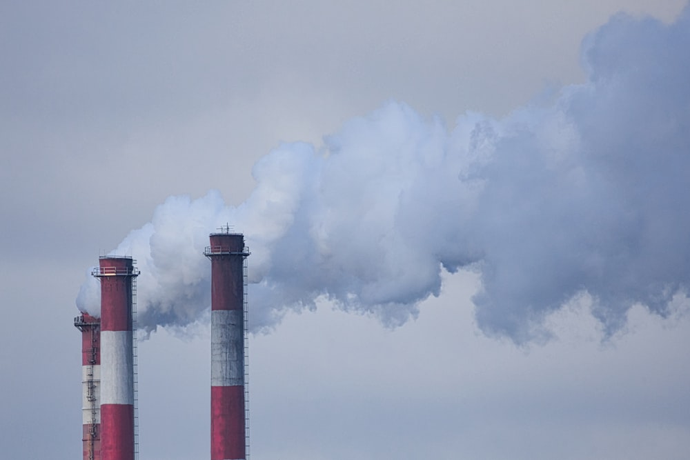 smoke billows from the stacks of smoke stacks