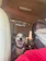 A happy golden retriever comfortably settled in a climate-controlled Furvela transport van.