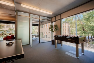 A professional office environment with game development elements.