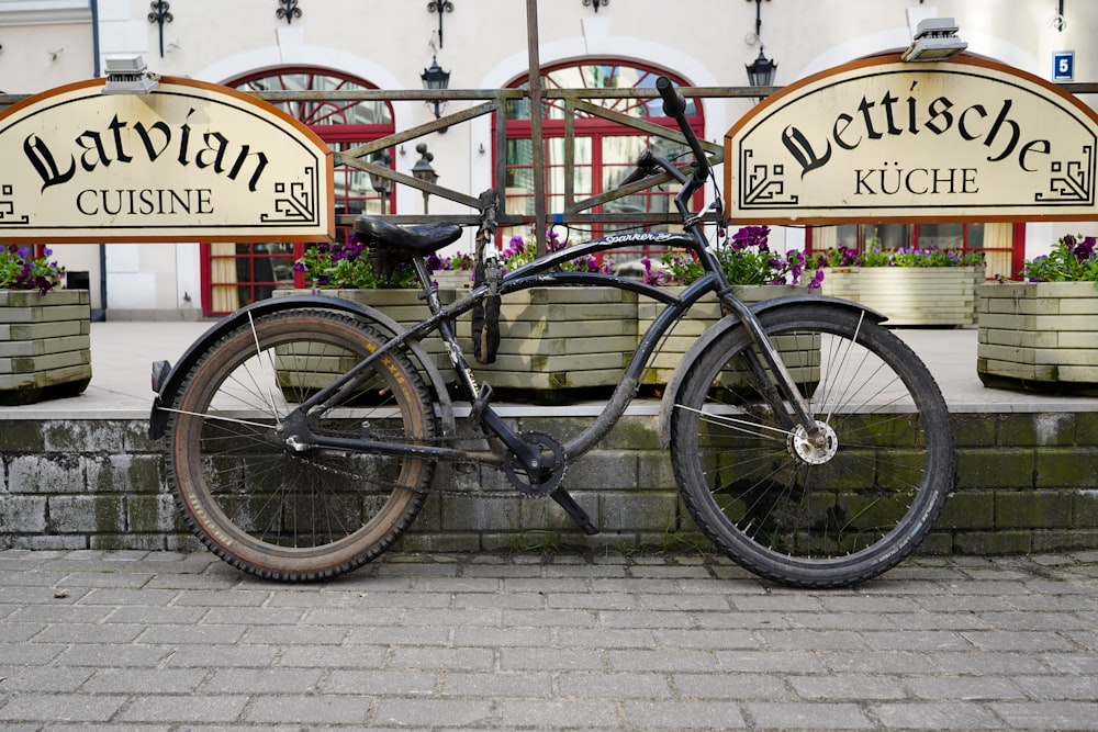 a bicycle parked in front of a restaurant