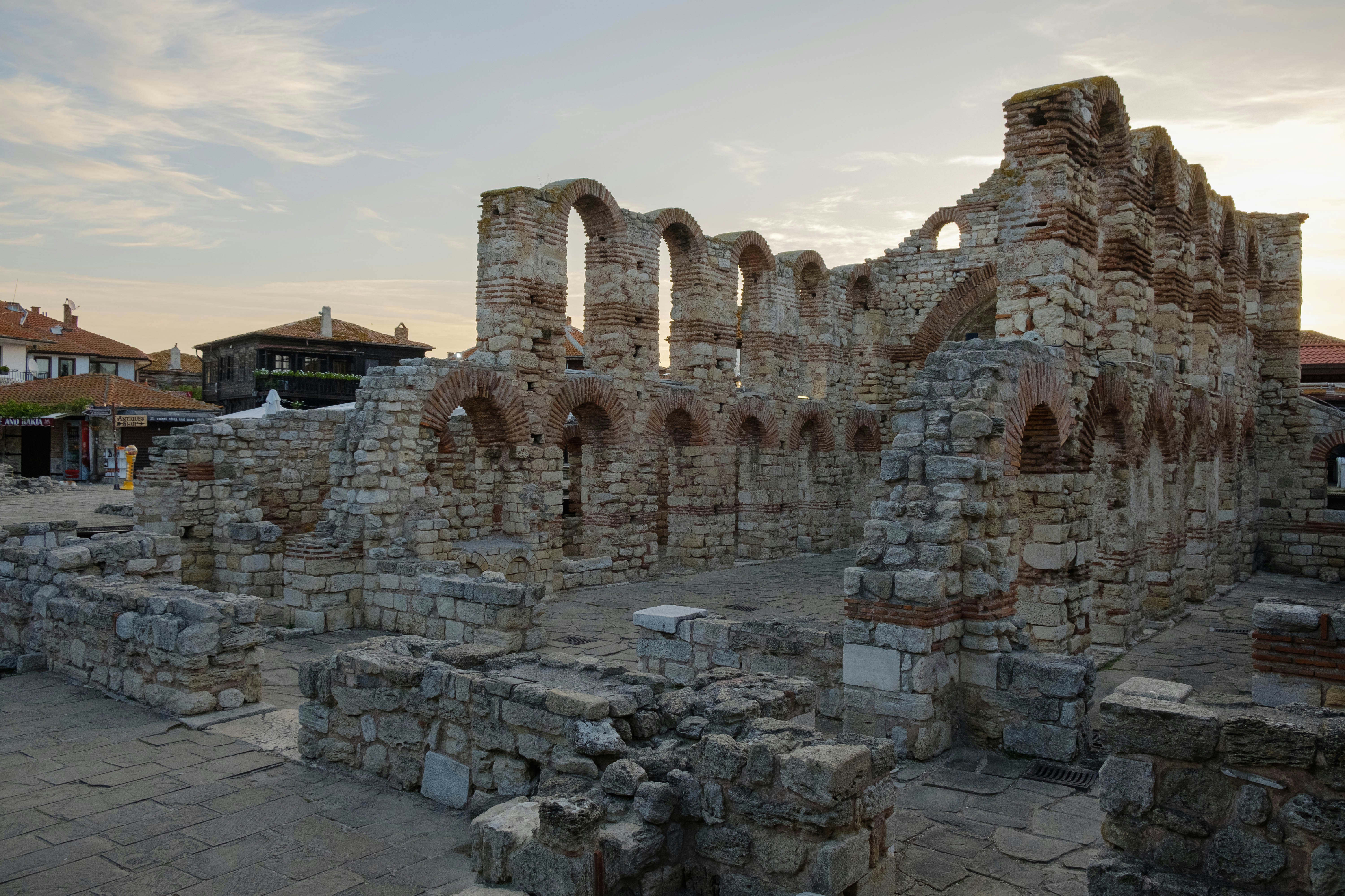 the ruins of a building with a sky in the background