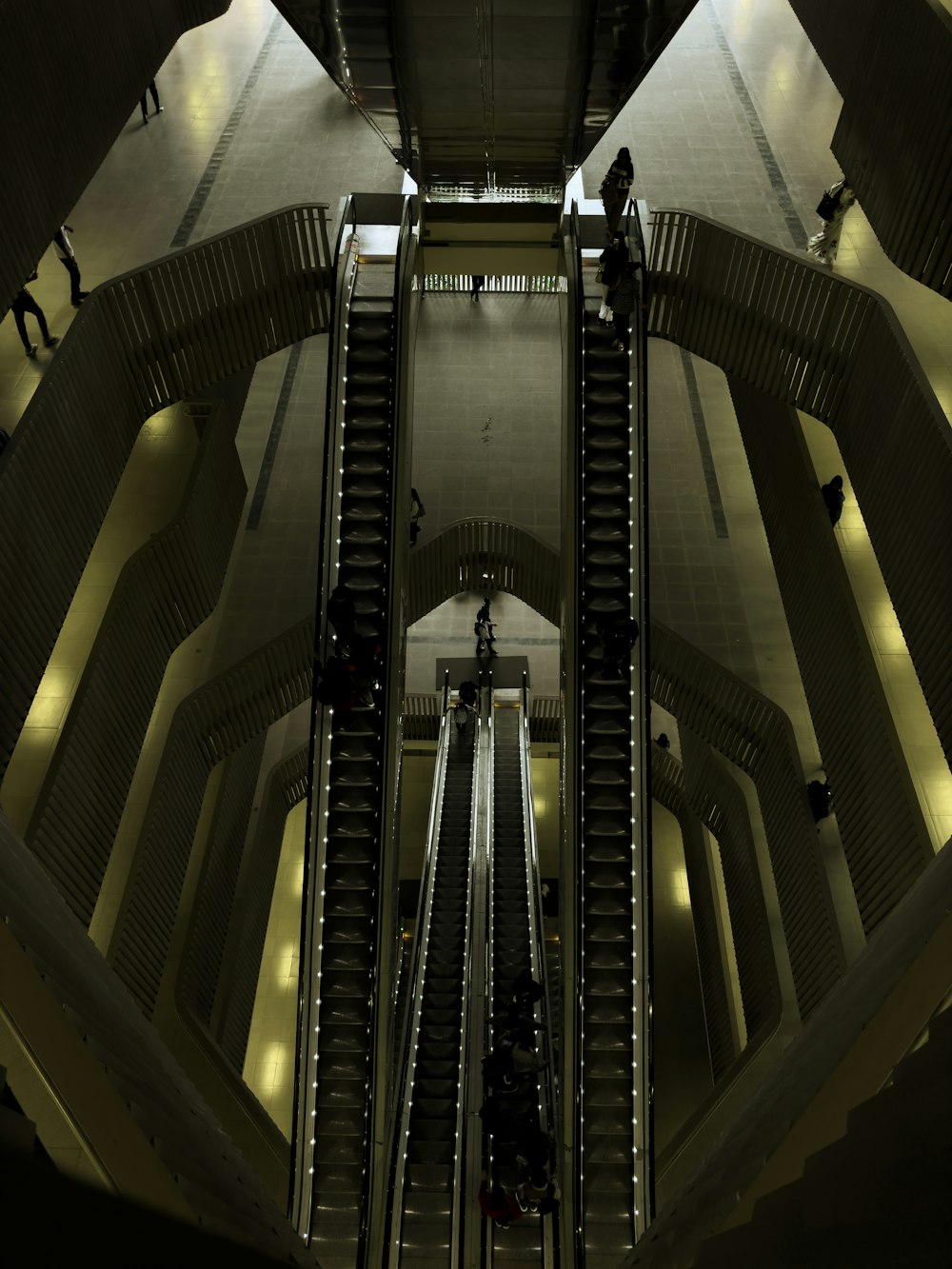 an escalator in a building with people on it