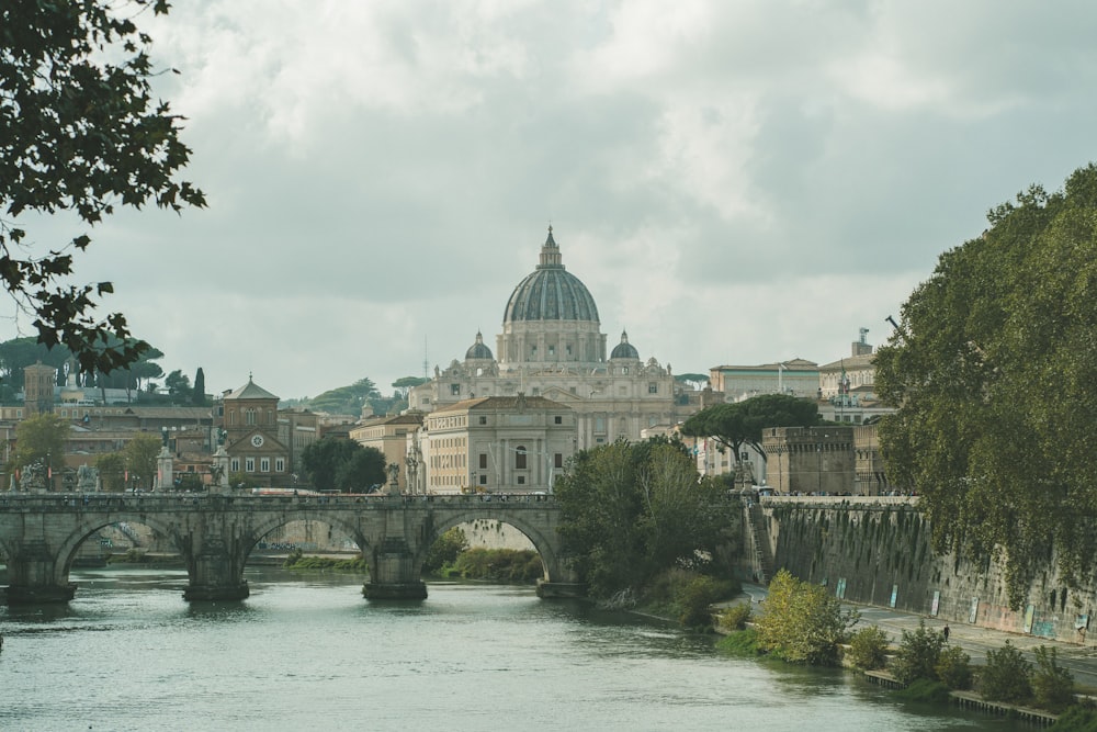 a river running through a city next to a bridge