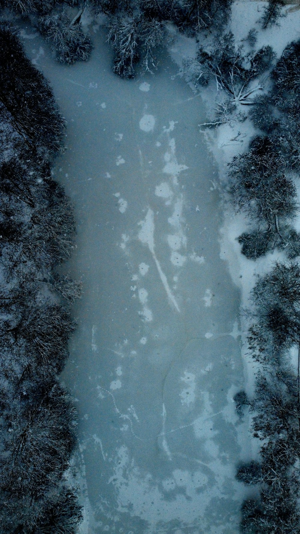 an aerial view of a snow covered area