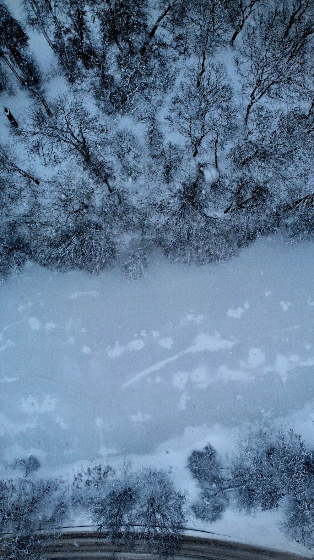a view of a snow covered hill from above