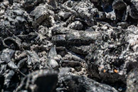 Close-up of fly ash particles under a microscope highlighting their fine texture.