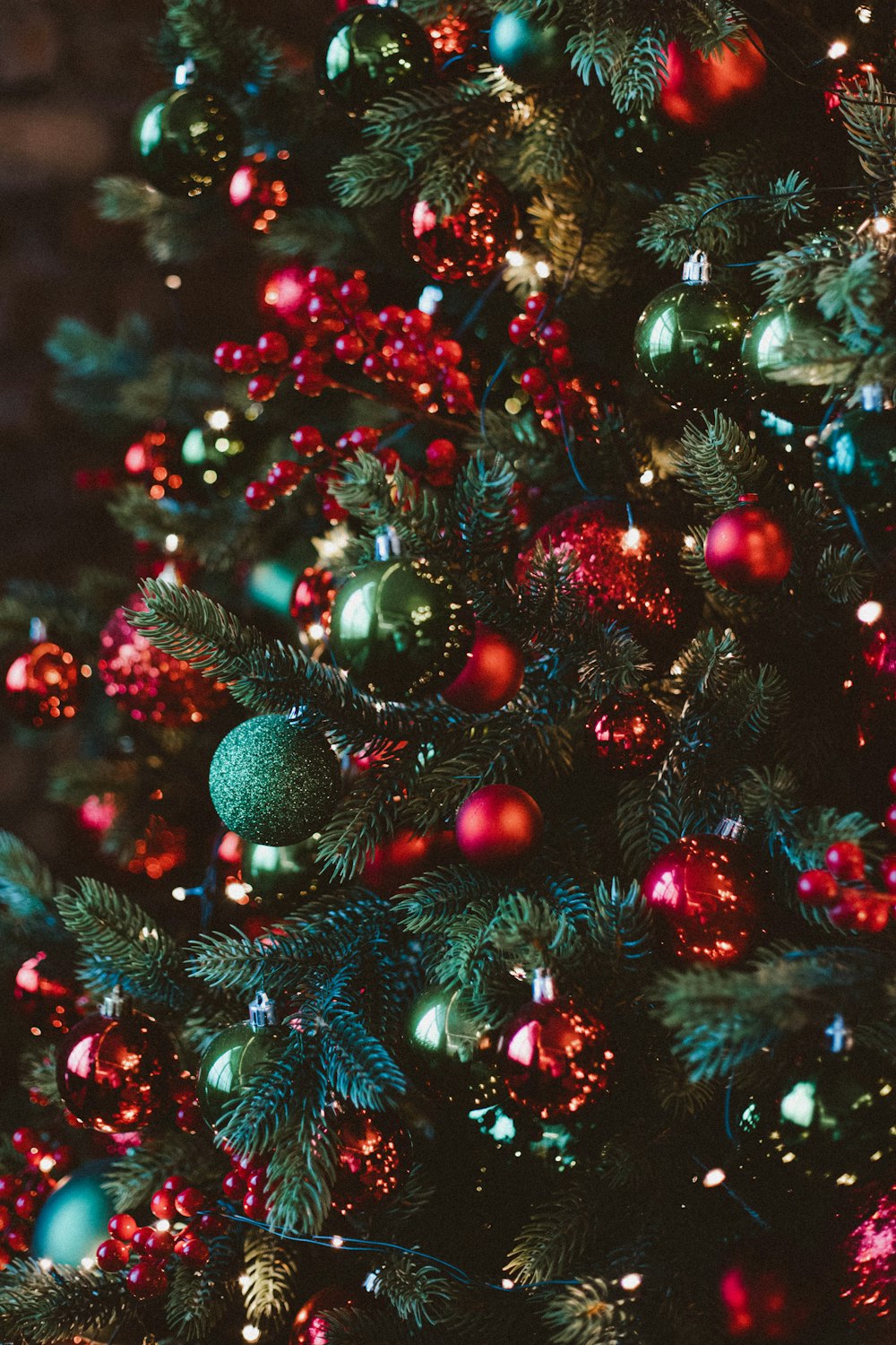 a christmas tree with red, green and blue ornaments