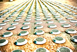A close-up of a weathered footpath with scattered cosmic symbols etched into the pavement.