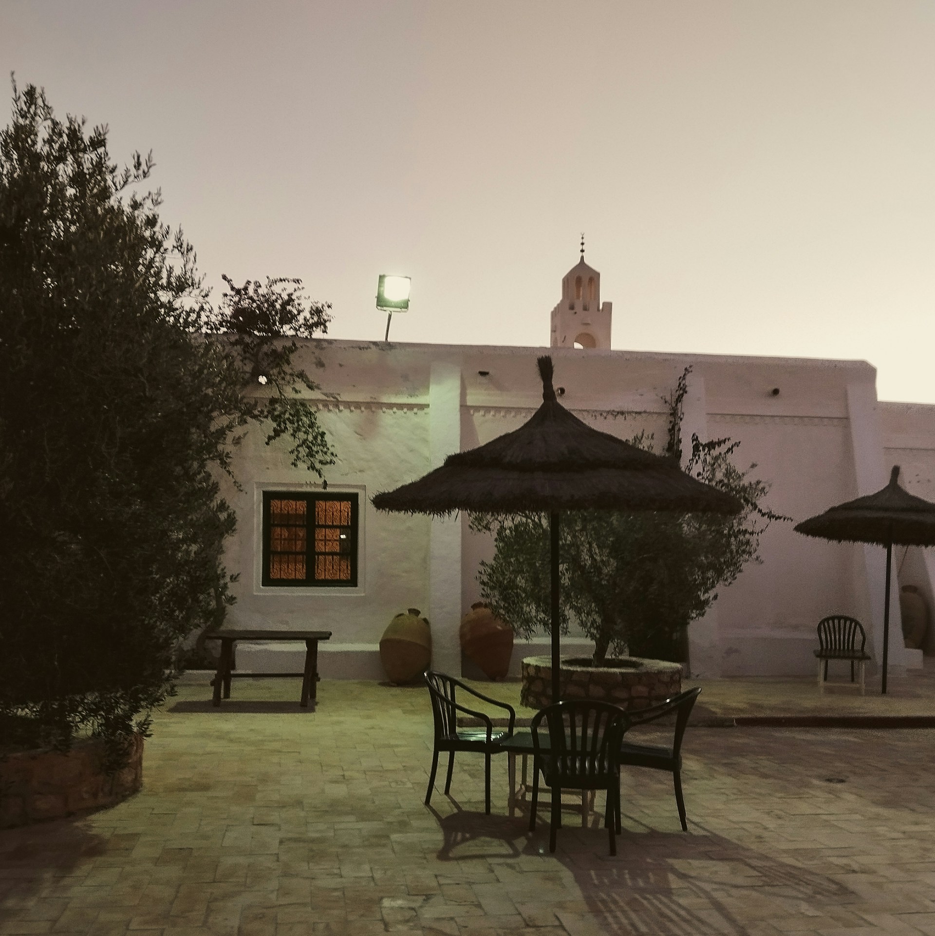 woman wearing yellow long-sleeved dress under white clouds and blue sky during daytime