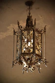 Elegant Victorian-style chandelier adding charm to a classic interior.
