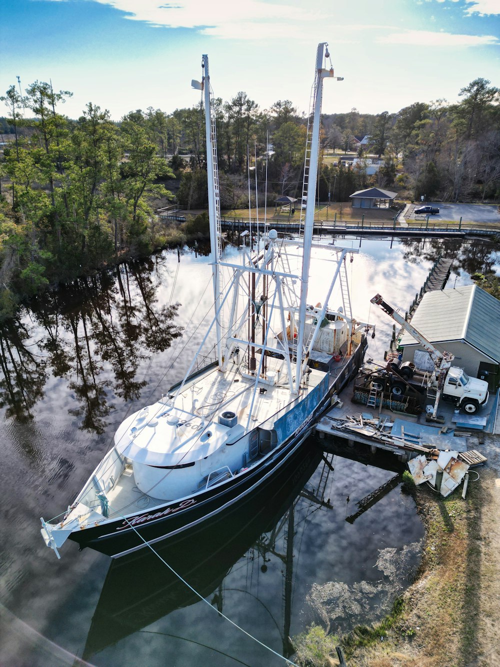 a boat docked at a dock in the water