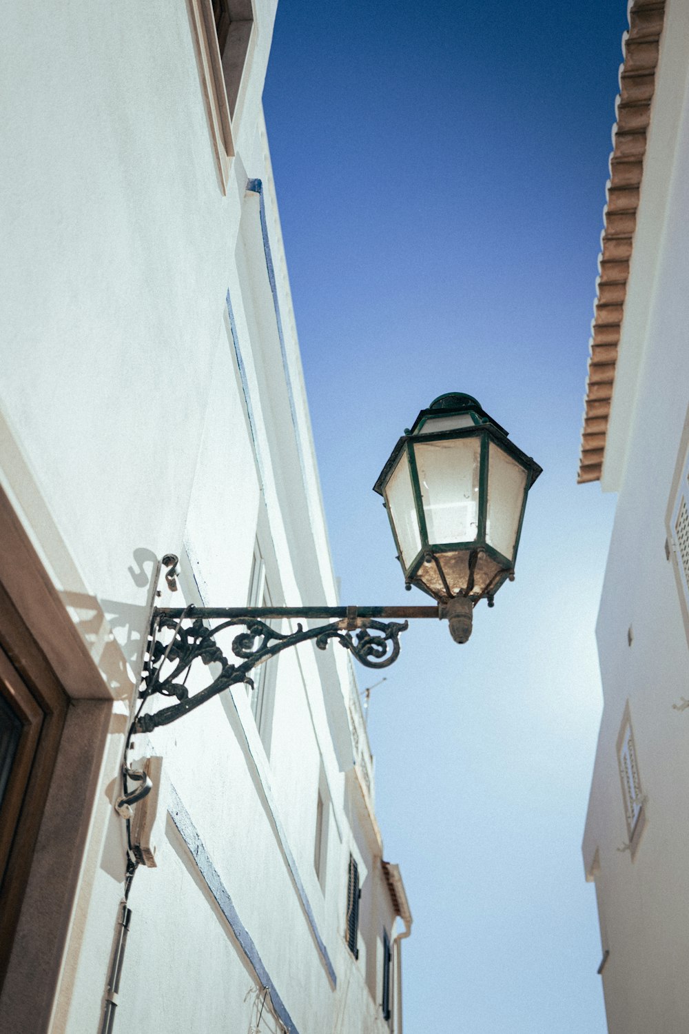 a street light hanging off the side of a building