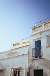 A freshly painted residential building exterior showcasing smooth, even coats of paint.