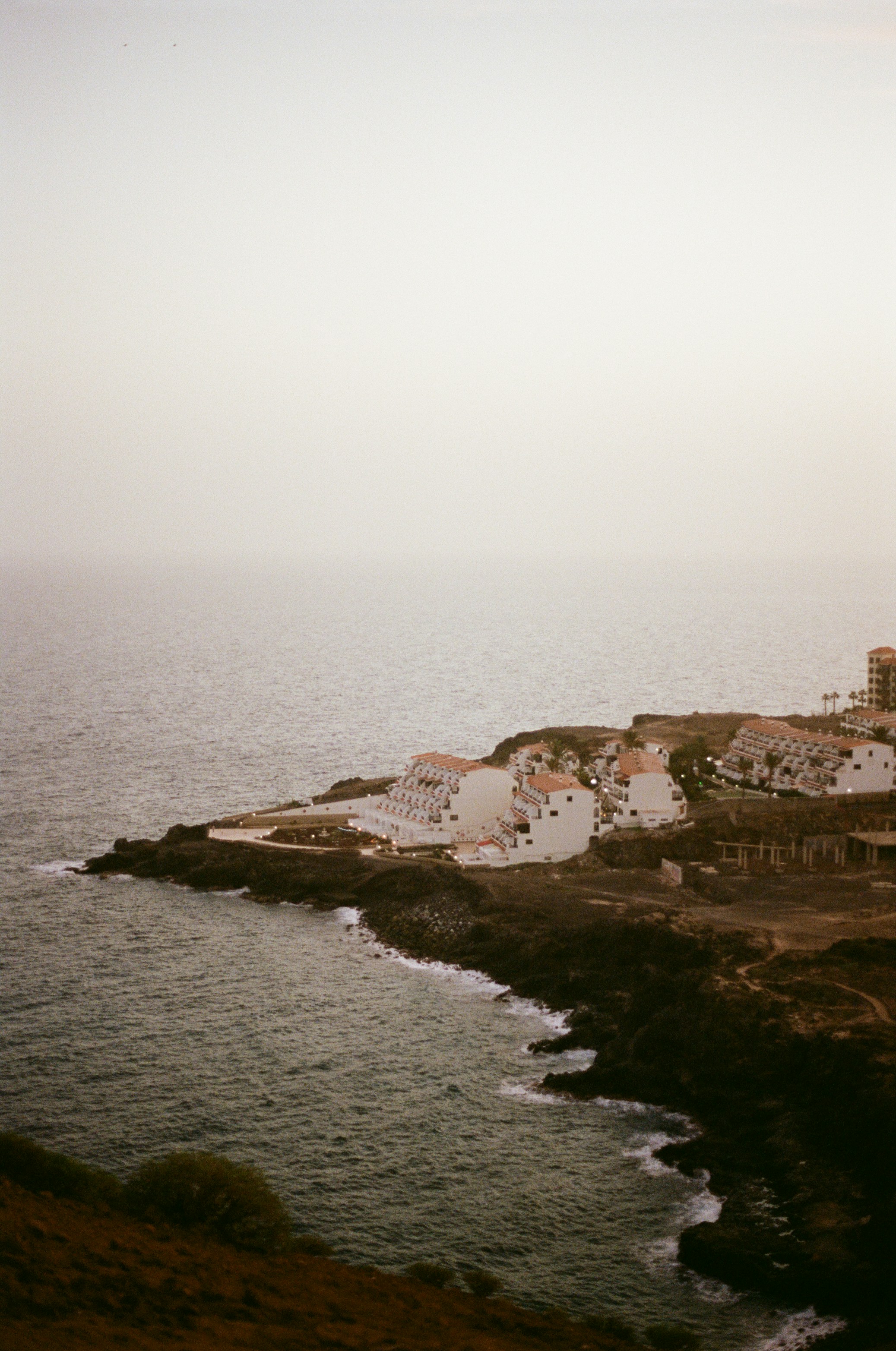 a view of the ocean from a hill