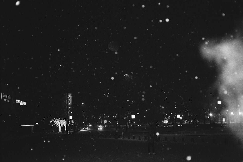 a black and white photo of a city at night