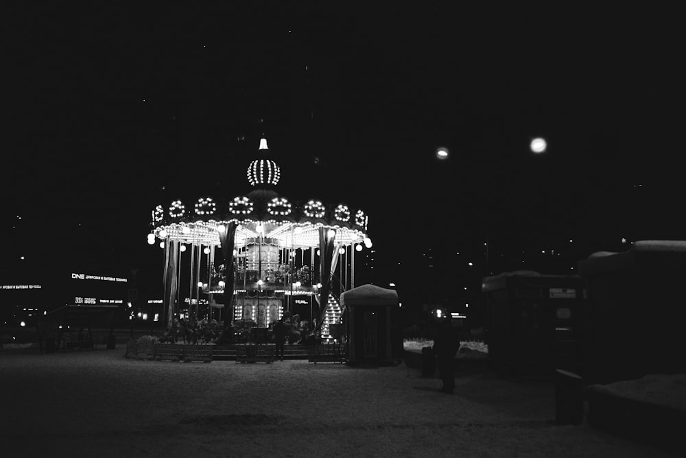 a merry go round lit up at night