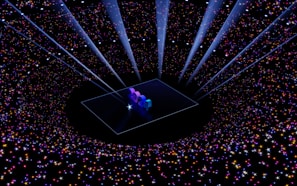 A digital art piece with the numbers '2024' illuminated on a platform at the center. Surrounding the platform, a vast array of multicolored stars and sparkles create a galaxy-like effect. Beams of light shine downwards, enhancing the futuristic and celebratory atmosphere.