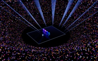 A digital art piece with the numbers '2024' illuminated on a platform at the center. Surrounding the platform, a vast array of multicolored stars and sparkles create a galaxy-like effect. Beams of light shine downwards, enhancing the futuristic and celebratory atmosphere.