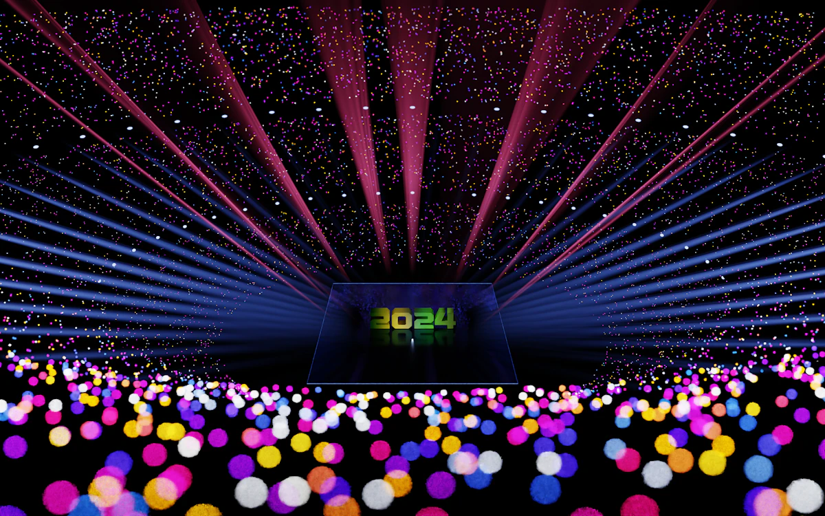 Crowd holding light sticks at a concert