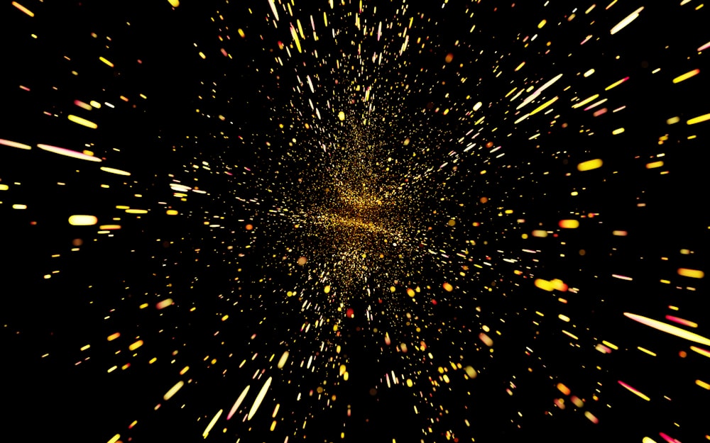 a black background with yellow and red speckles