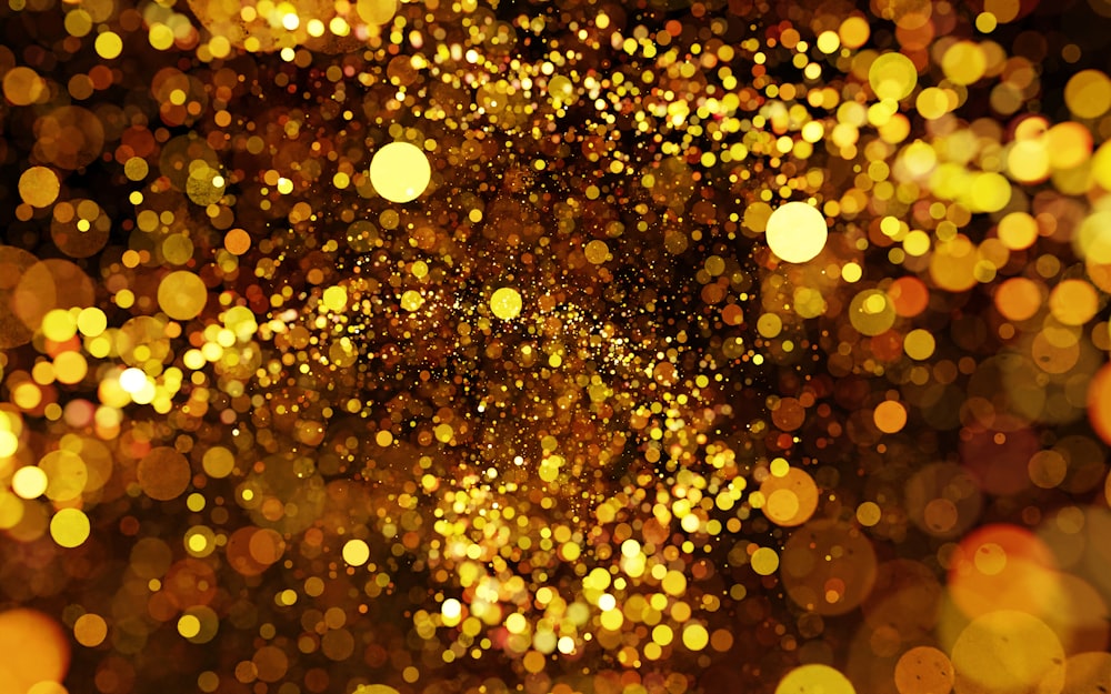 a blurry image of a gold glitter background