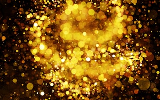 Motion graphics composition with shimmering golden elements on a black canvas.