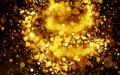 Motion graphics composition with shimmering golden elements on a black canvas.