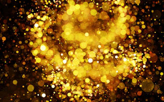 A golden film reel glowing against a sleek black background, symbolizing the festival’s elegance.