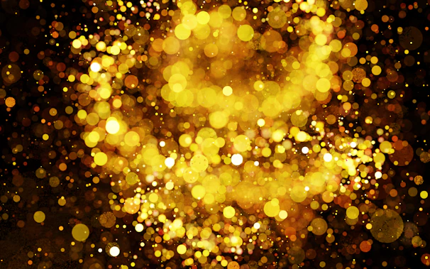 A golden film reel glowing against a sleek black background, symbolizing the festival’s elegance.