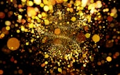 Close-up of sparkling particles merging into a new, radiant form.
