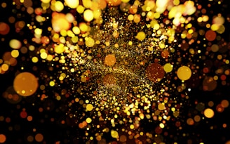 A colorful debt dissolver charm dissolving into golden particles over a dark purple backdrop.