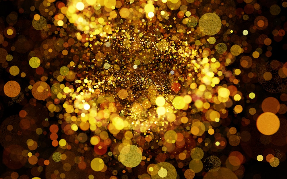 a blurry image of a gold glitter background