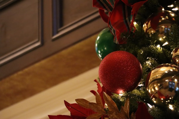 Close-up of elegant Christmas card decorations featuring glittery snowflakes and festive ribbons.