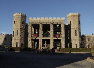 Elegant stone castle facade blending with modern luxury real estate in Ambato.
